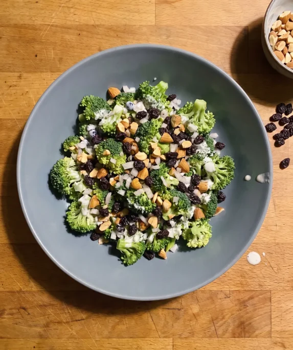 Gordon Ramsay broccoli salad: raw broccoli florets with currants, toasted almonds and diced shallot in a yogurt dressing