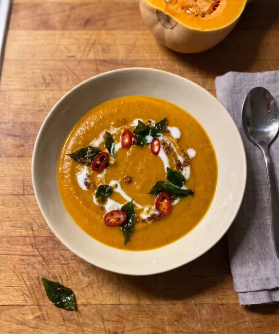 Gordon Ramsay butternut squash soup: orange spiced squash and lentil soup with a swirl of coconut cream, crisp curry leaves and sliced red chile