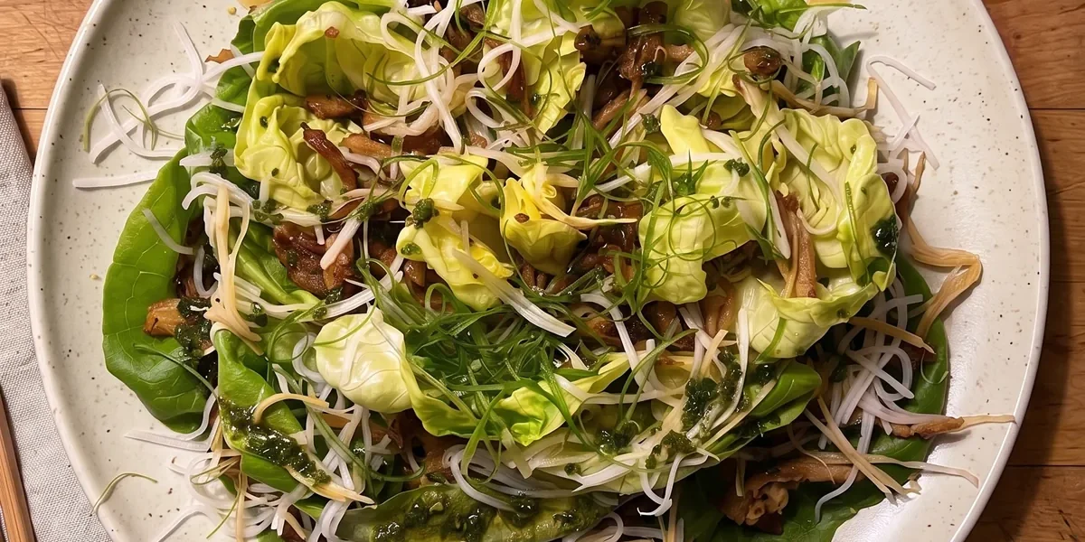 Gordon Ramsay crispy chicken salad: a whole butter lettuce opened like a flower with hoisin-glazed crispy shredded chicken, pickled daikon, ginger and scallions