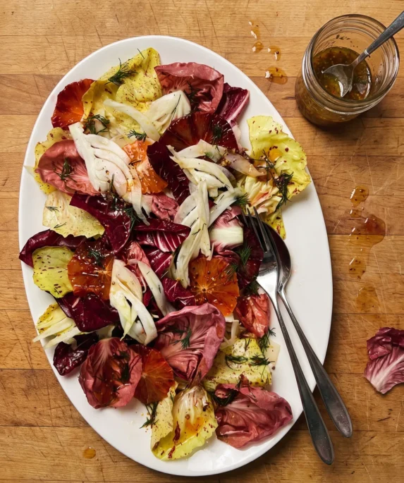 Gordon Ramsay fennel salad: shaved fennel, blood orange rounds and torn red and pale radicchio with dill dressing on a platter