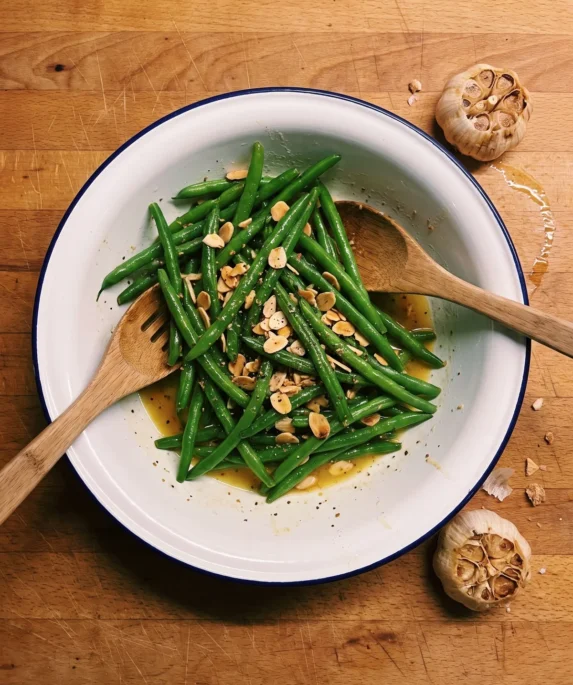 Gordon Ramsay green bean salad with mustard dressing: blanched green beans and toasted flaked almonds in a roasted garlic Dijon dressing