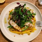 Gordon Ramsay mango, avocado and smoked chicken salad: sliced mango, avocado strips and smoked chicken under a pile of mixed leaves with a wholegrain mustard dressing