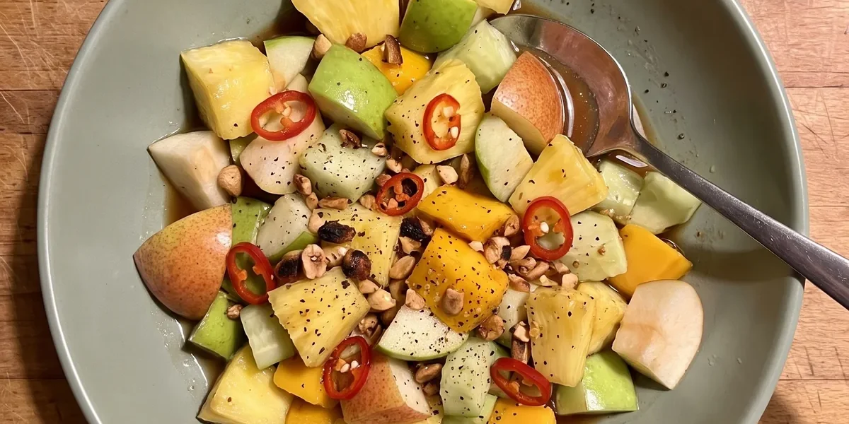 Gordon Ramsay spicy fruit salad: pineapple, green apple, pear, mango and cucumber in a tamarind chili dressing with crushed peanuts and red chili