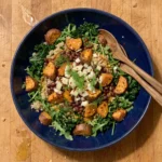 Gordon Ramsay sweet potato salad with roasted sweet potato, aduki beans, quinoa, kale, arugula and fennel in a bowl
