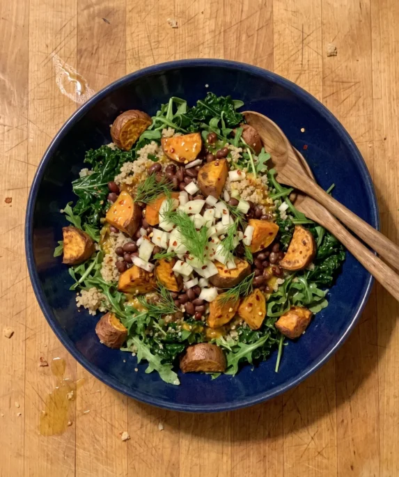 Gordon Ramsay sweet potato salad with roasted sweet potato, aduki beans, quinoa, kale, arugula and fennel in a bowl